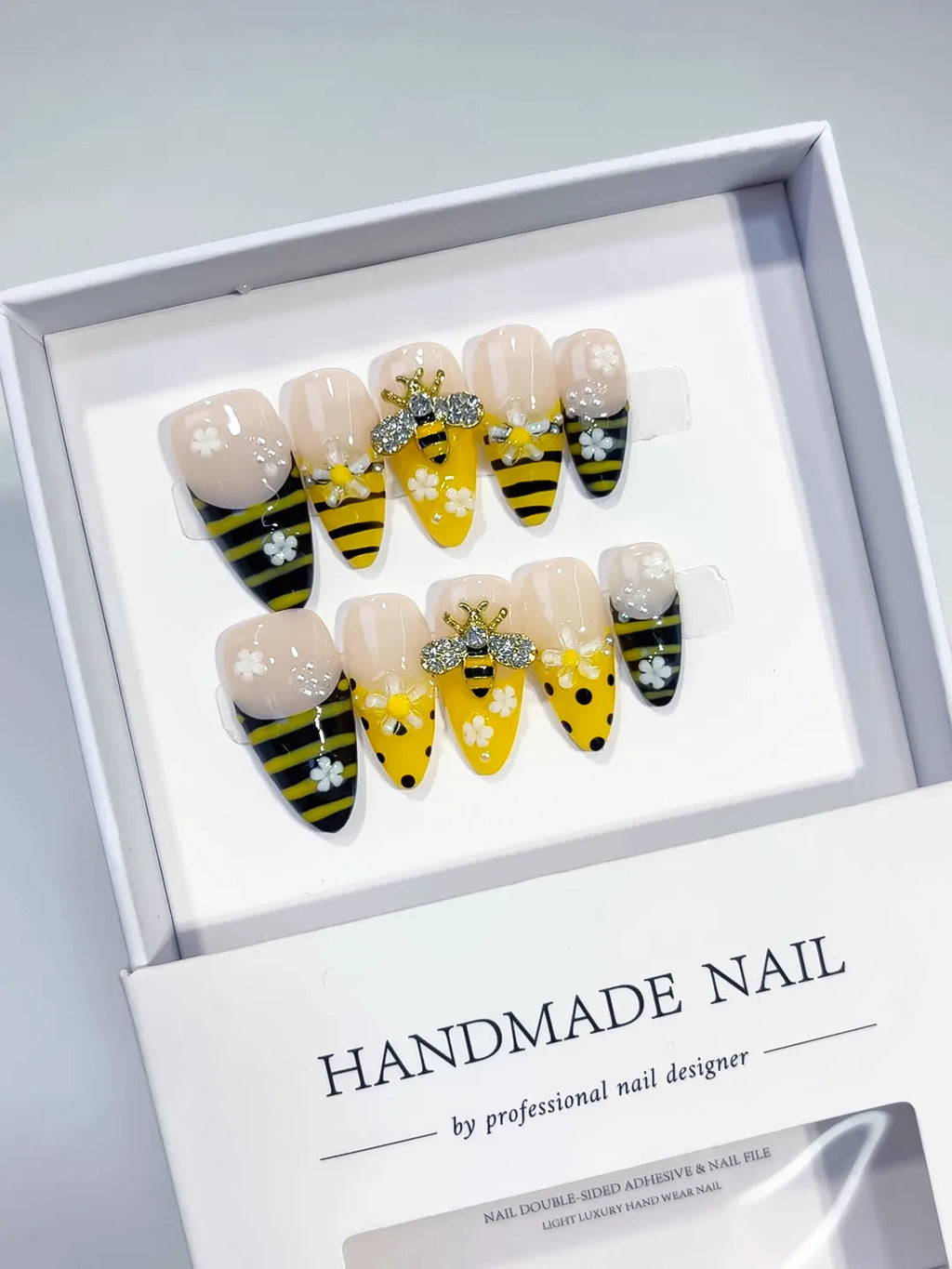 Yellow Black White Abstract Bee Flower Rhinestone press on nails angled view