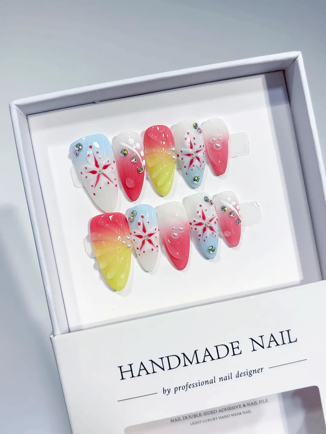 Nude White Blue Yellow French tip Flower Bow Star press on nails angled view