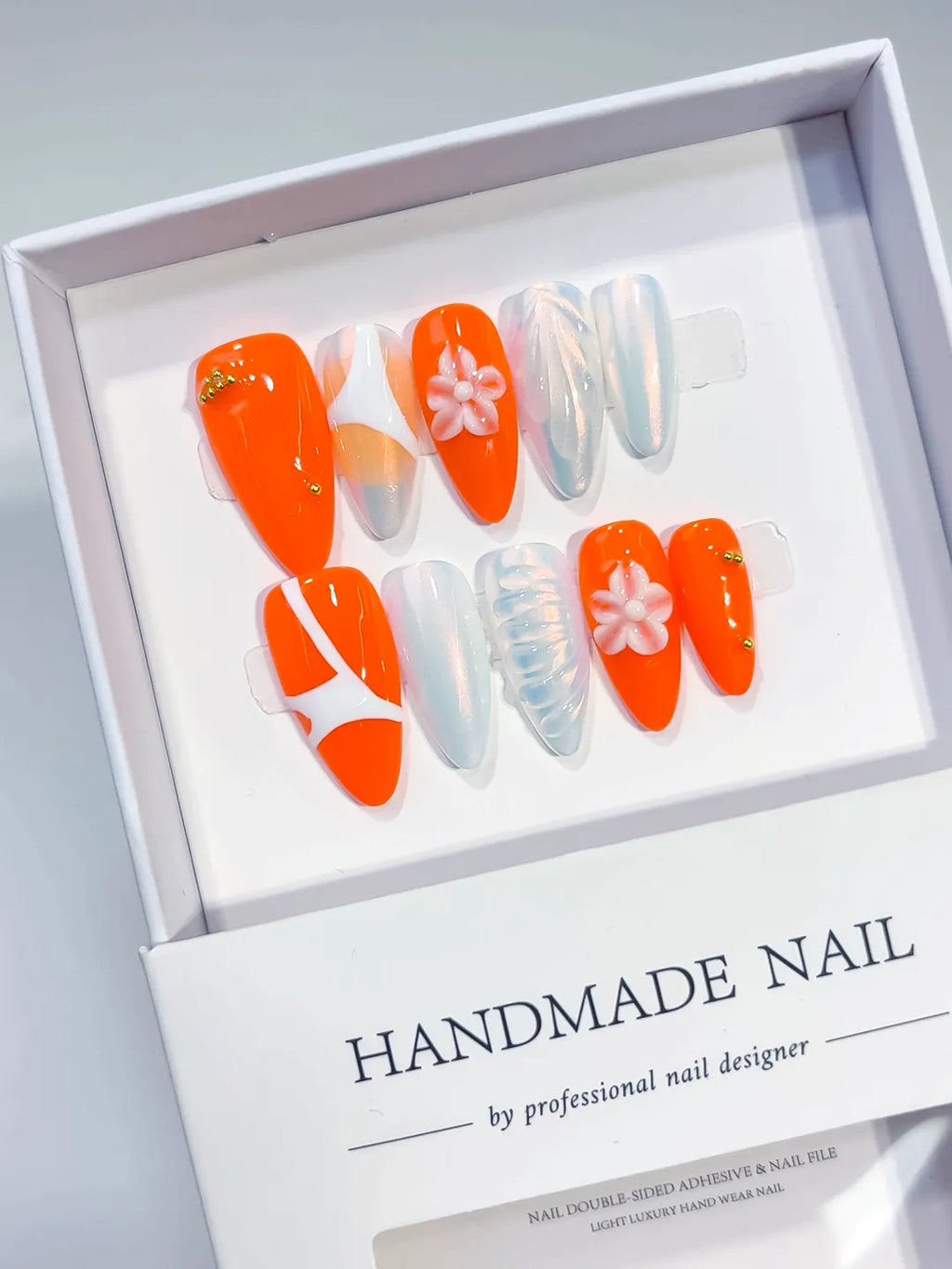 Orange White Abstract Flower Shell press on nails angled view