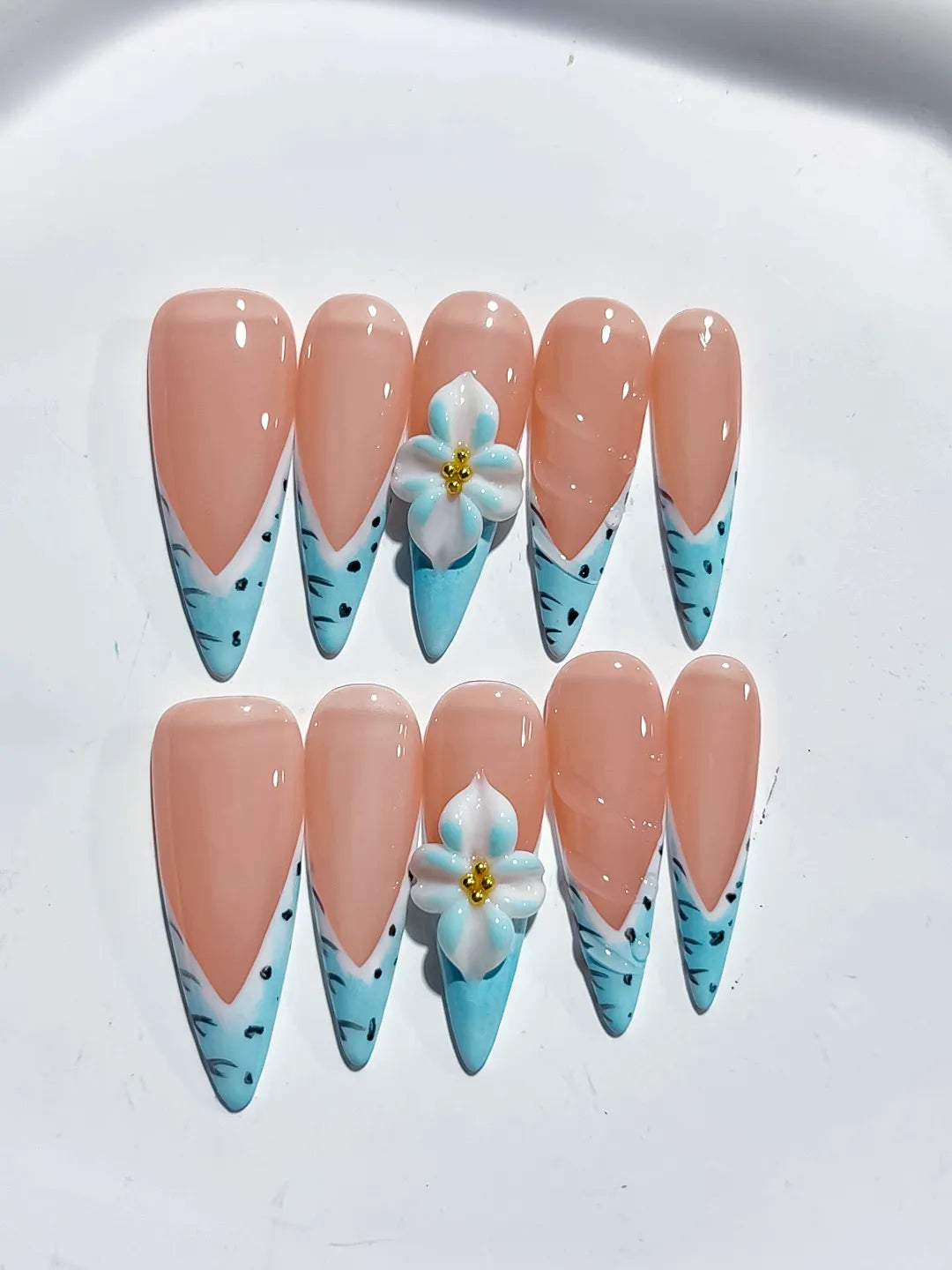 Nude Blue French tip Flower Animal Print press on nails close up