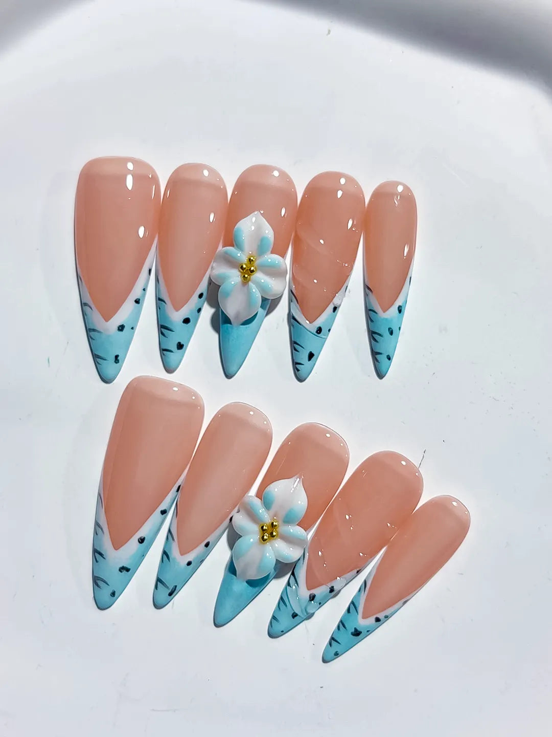Nude Blue French tip Flower Animal Print press on nails detail view