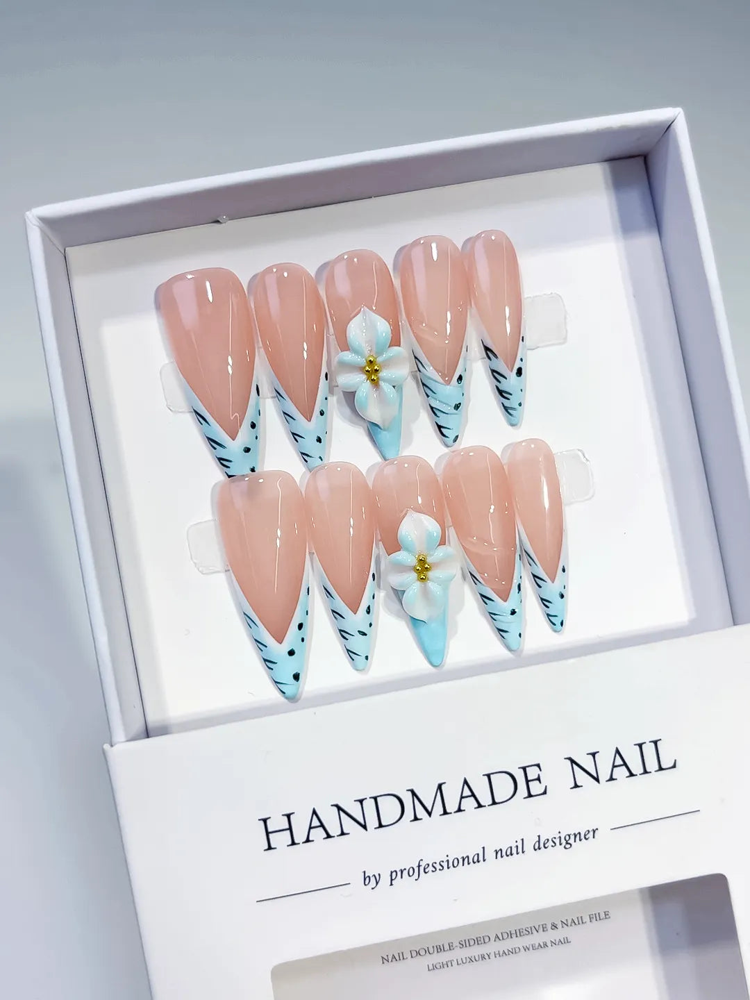 Nude Blue French tip Flower Animal Print press on nails angled view