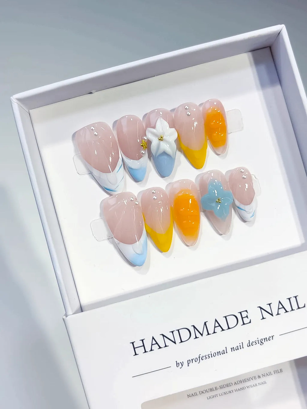 Nude Blue Yellow White French tip Flower Pearl press on nails angled view