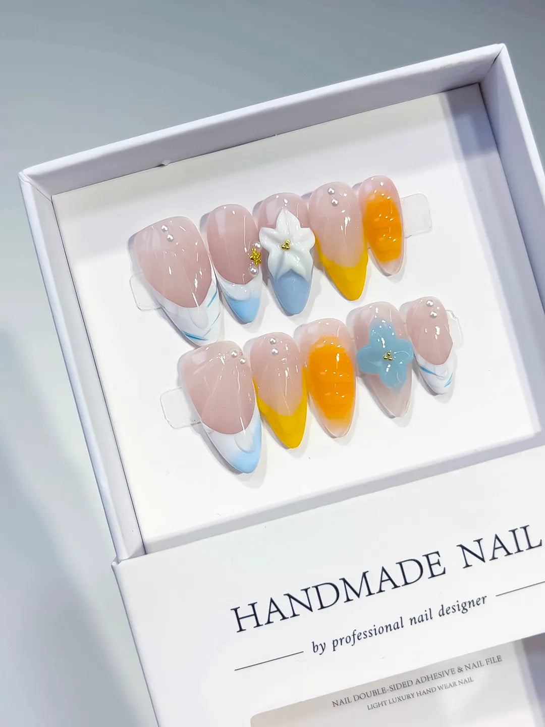 Nude Blue Yellow White French tip Flower Pearl press on nails angled view