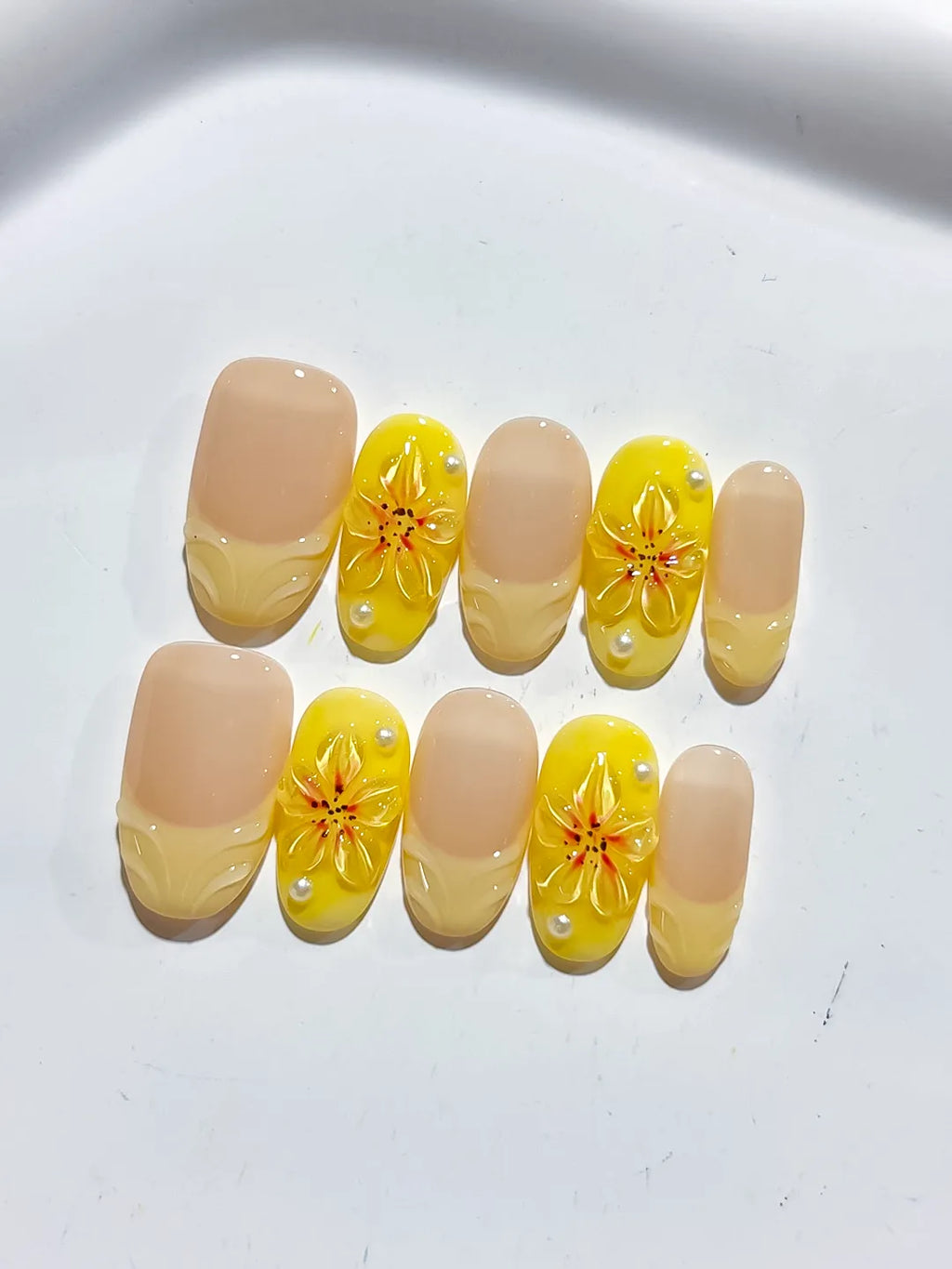 Nude Yellow French tip Flower press on nails close up