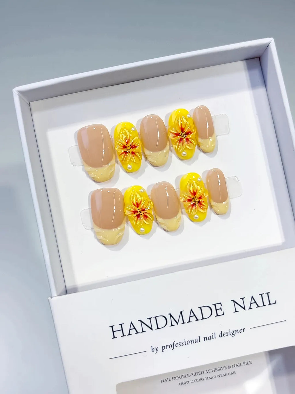 Nude Yellow French tip Flower press on nails angled view