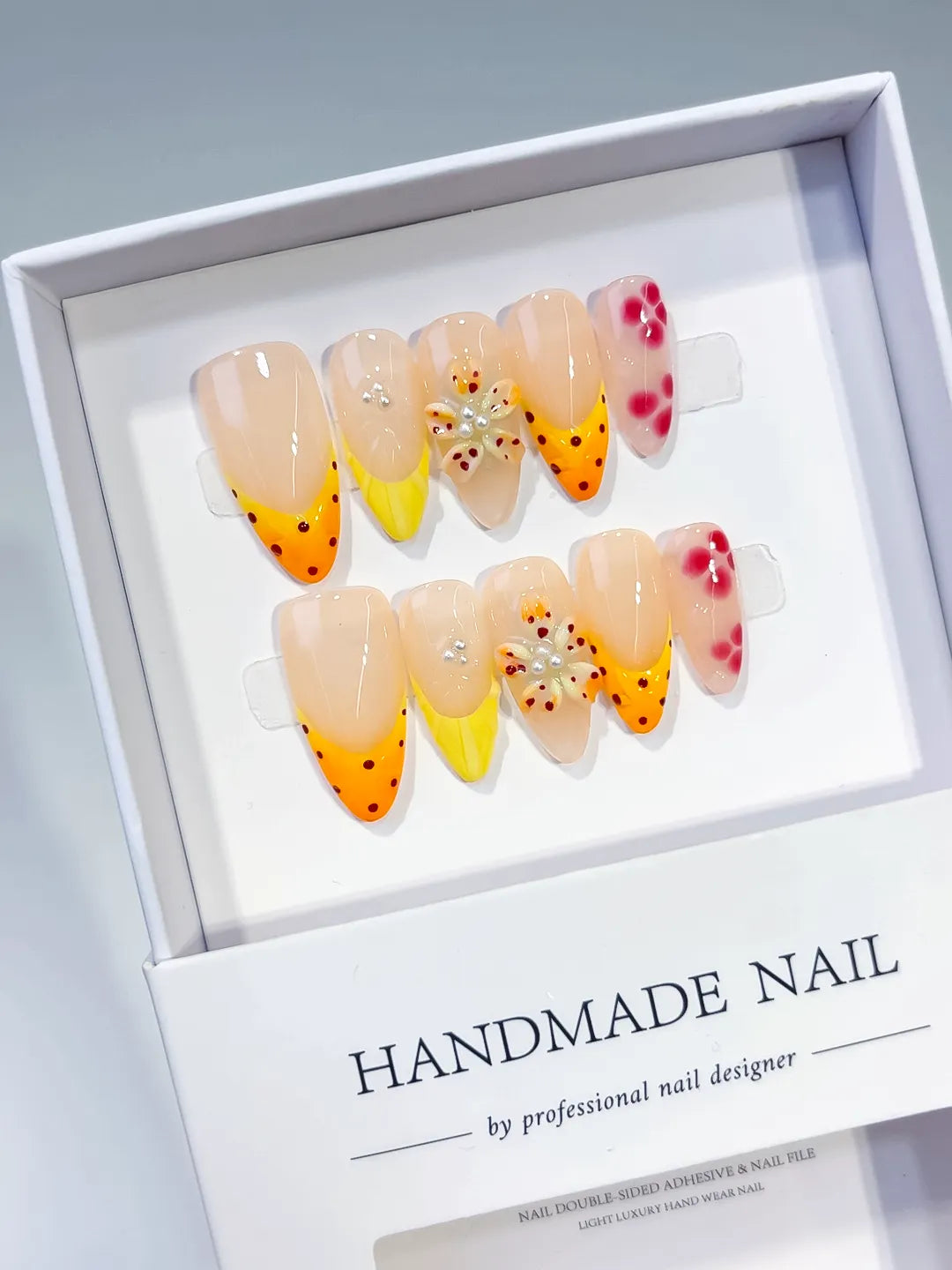 Nude Yellow Pink French tip Flower Dot Pattern press on nails angled view