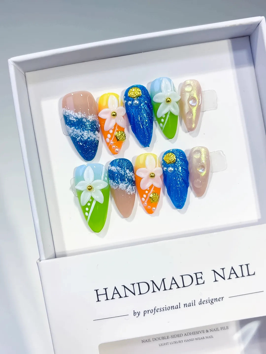 Blue Green Orange Gold Silver Abstract Flower Glitter press on nails angled view