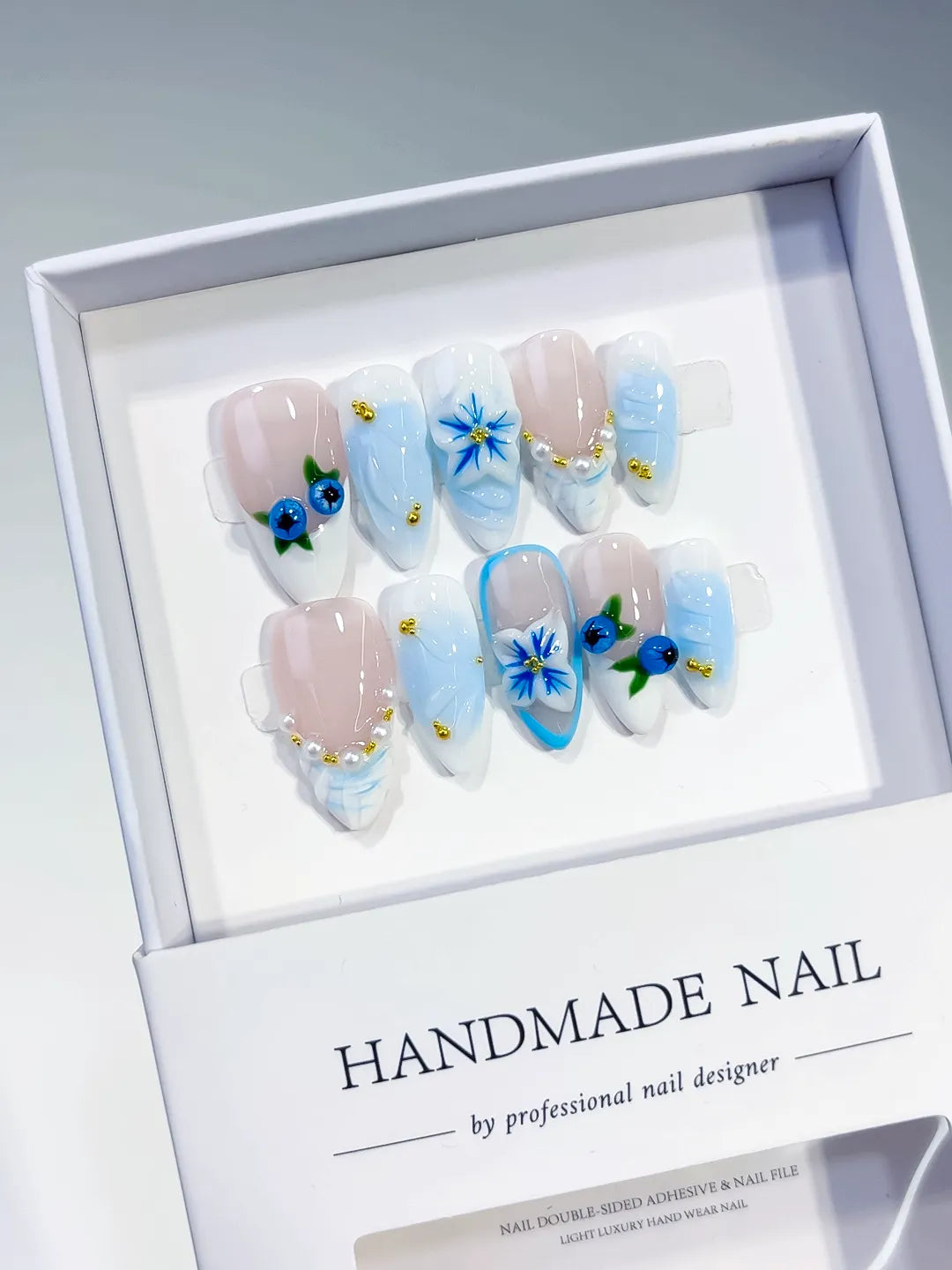 Nude Blue White French tip Flower Pearl press on nails angled view