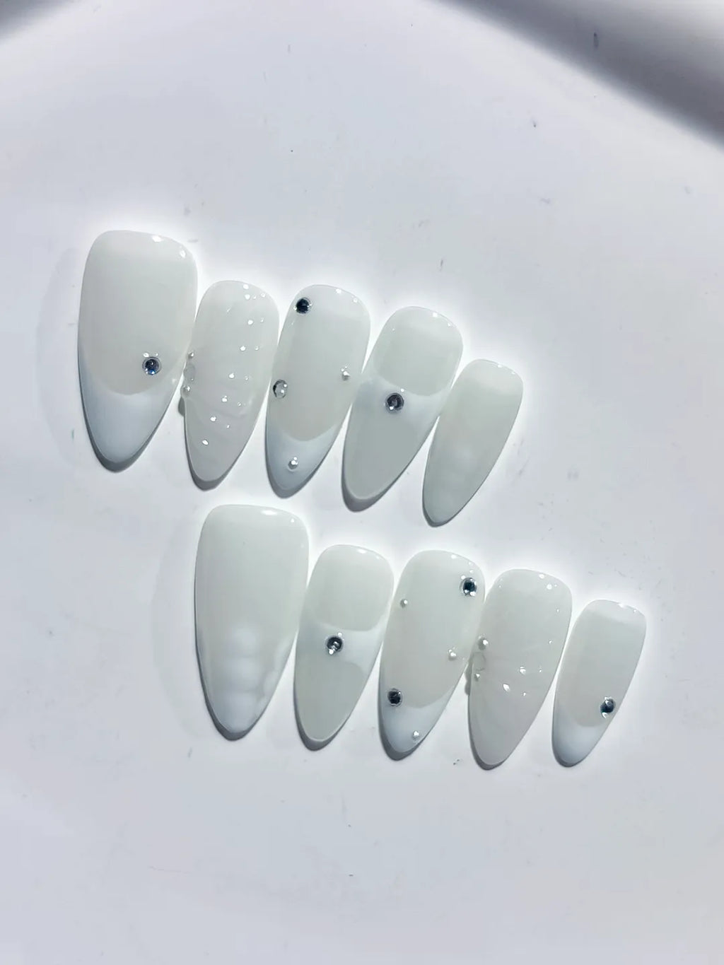 White Solid color Rhinestone Shell press on nails close up