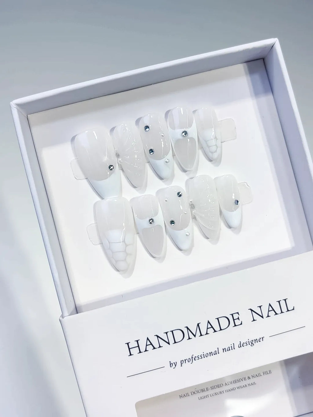 White Solid color Rhinestone Shell press on nails angled view