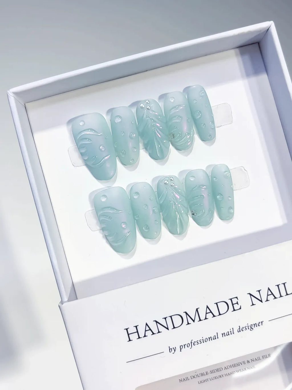 Green Solid color Leaf Pearl press on nails angled view