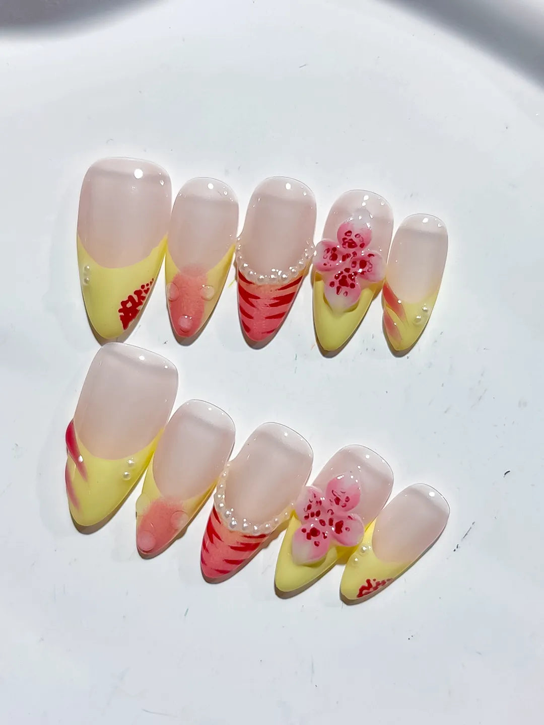 Nude Yellow Pink French tip Flower Pearl Stripe press on nails close up