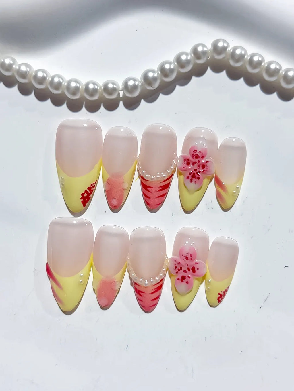 Nude Yellow Pink French tip Flower Pearl Stripe press on nails detail view