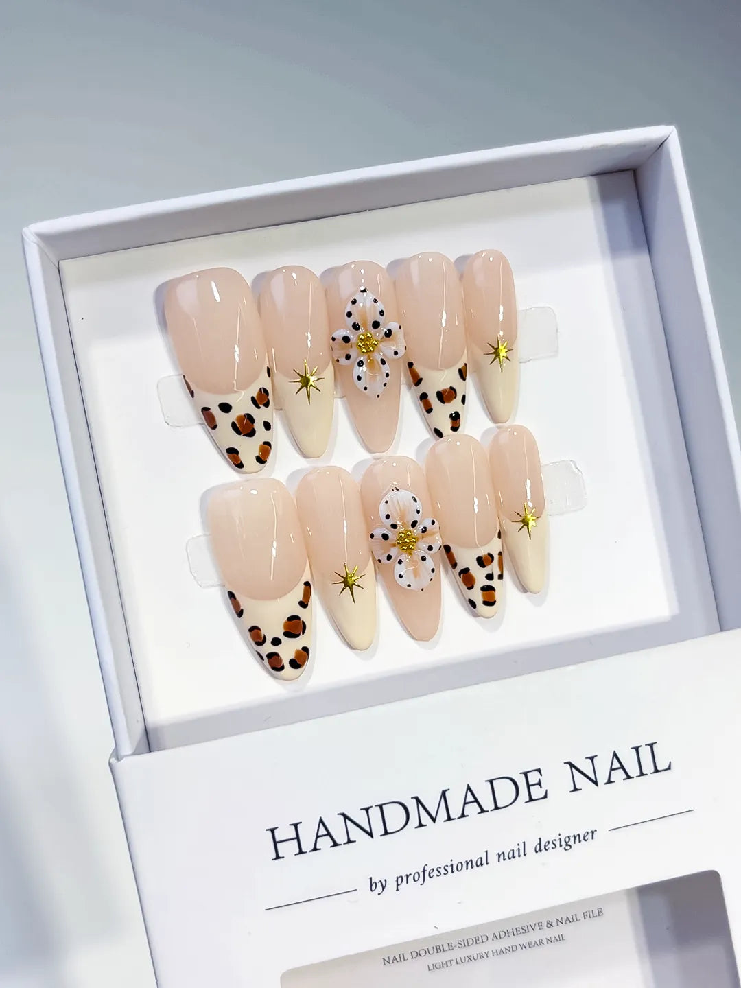 Nude Brown White French tip Flower Animal Print Star press on nails angled view