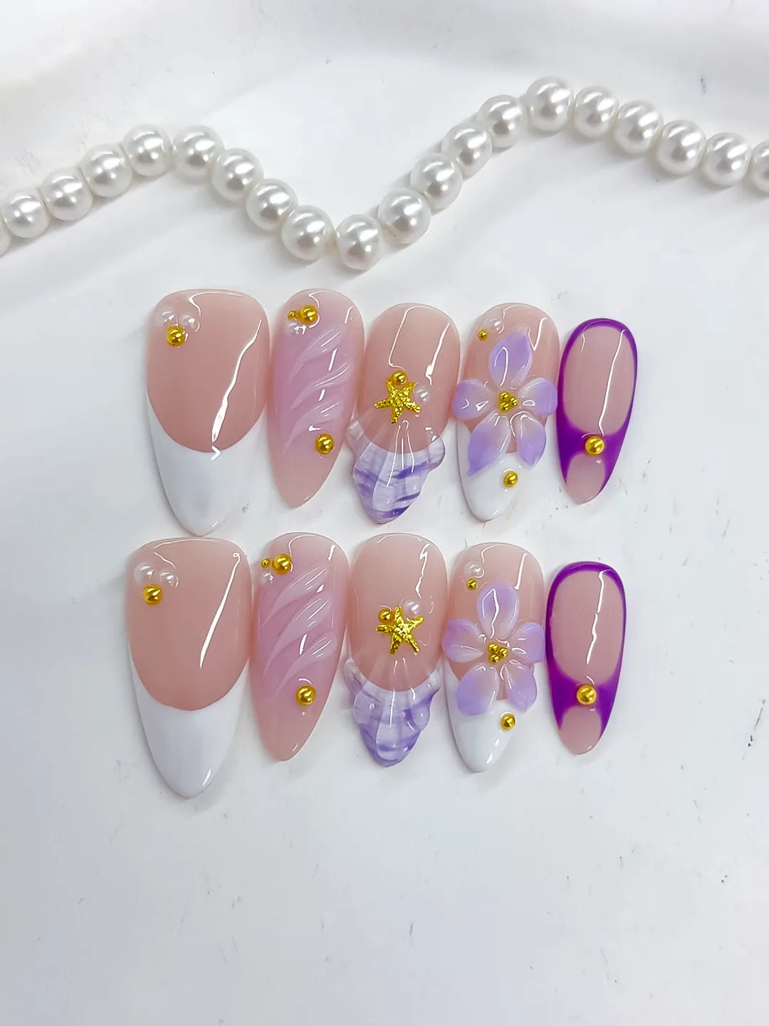 Nude White Purple French tip Flower Shell Stud press on nails close up