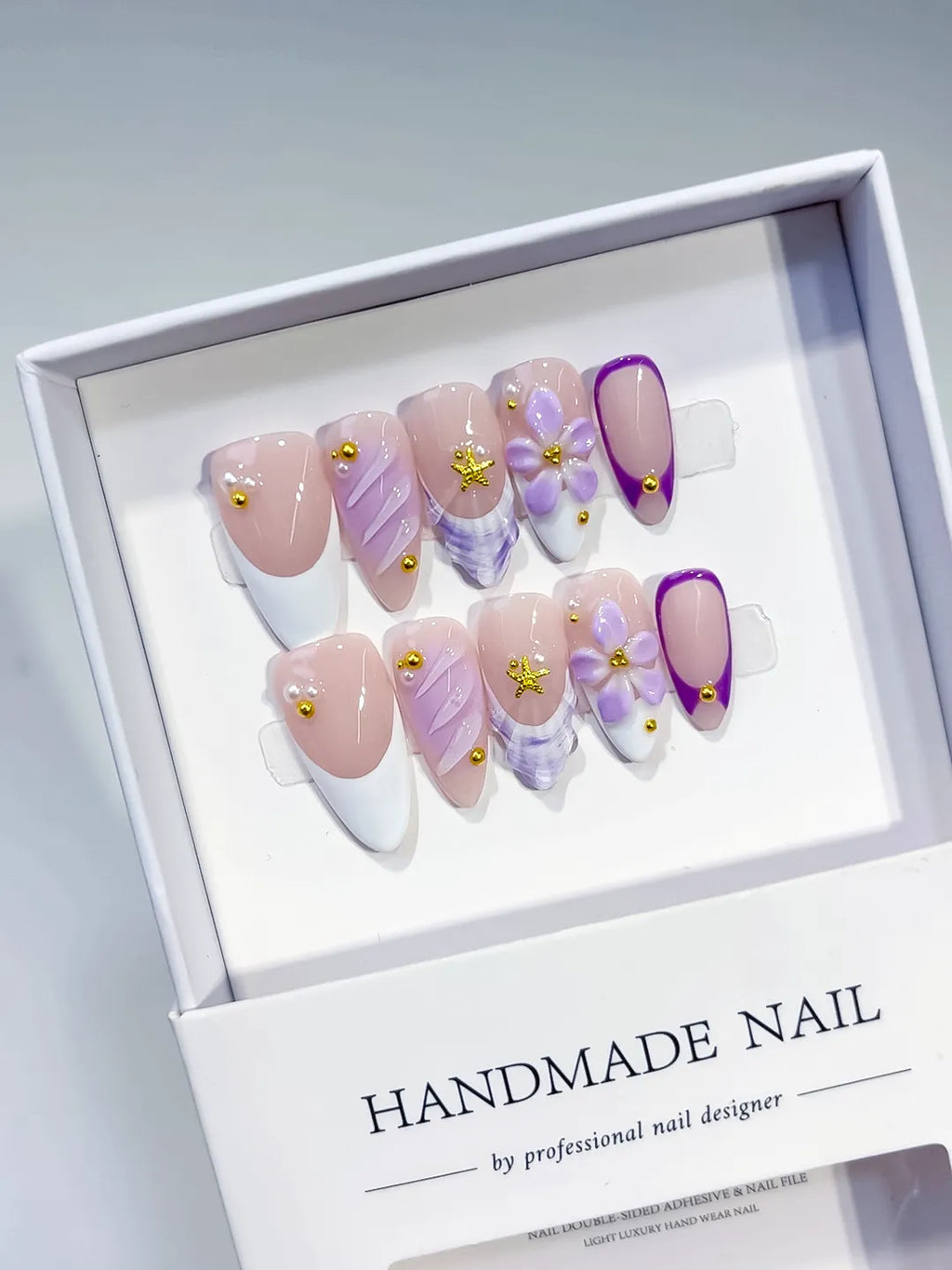 Nude White Purple French tip Flower Shell Stud press on nails angled view