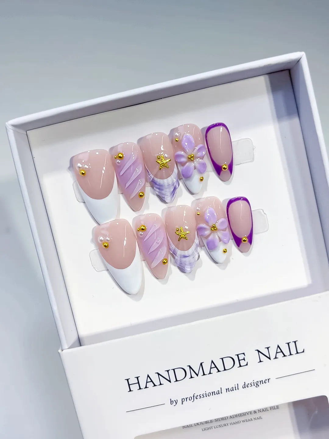 Nude White Purple French tip Flower Shell Stud press on nails angled view