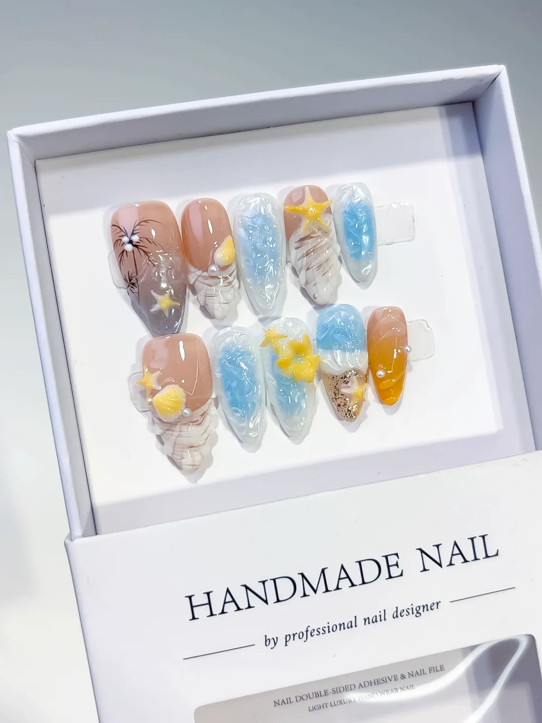 Nude Blue Yellow White Abstract Flower Star Shell press on nails angled view