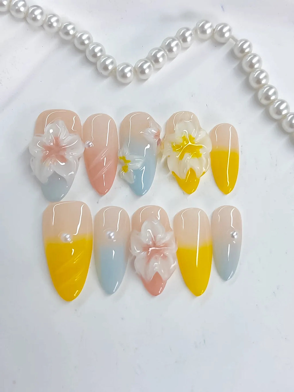 Nude Yellow Blue White French tip Flower Pearl press on nails detail view
