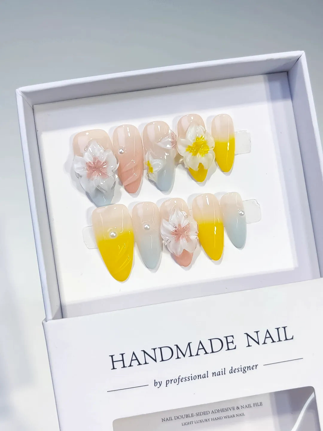 Nude Yellow Blue White French tip Flower Pearl press on nails angled view