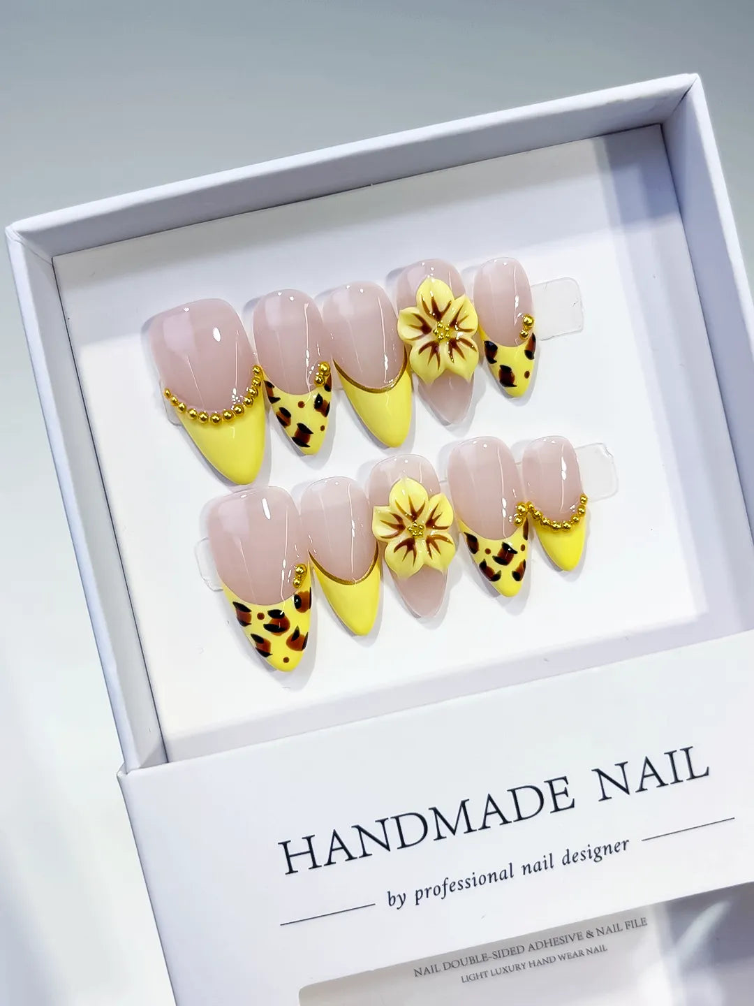 Nude Yellow Black Gold French tip Flower Animal Print Metallic Charm press on nails angled view