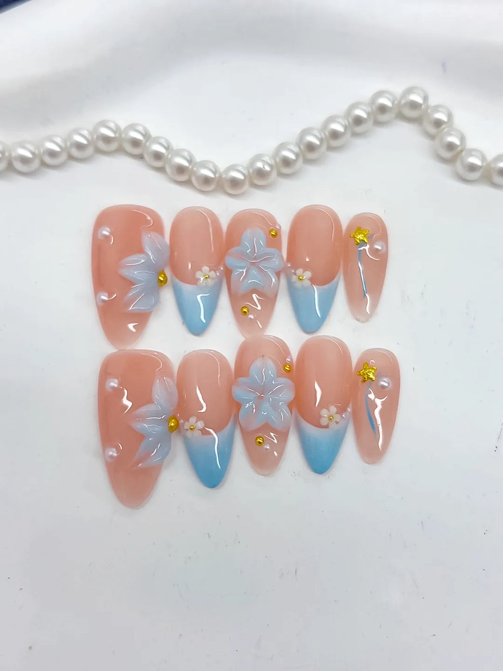 Nude Blue French tip Flower Star Rhinestone press on nails detail view