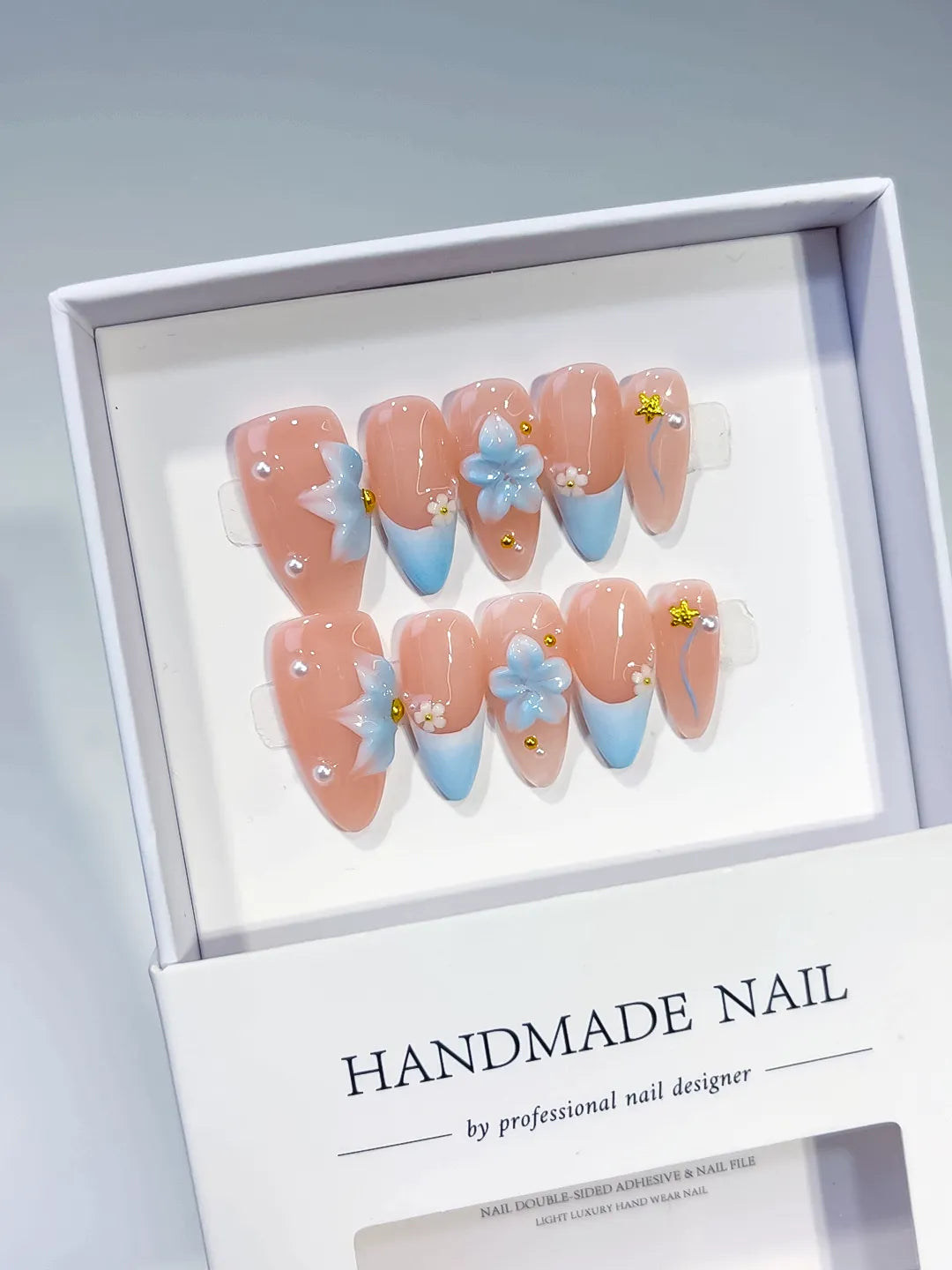 Nude Blue French tip Flower Star Rhinestone press on nails angled view