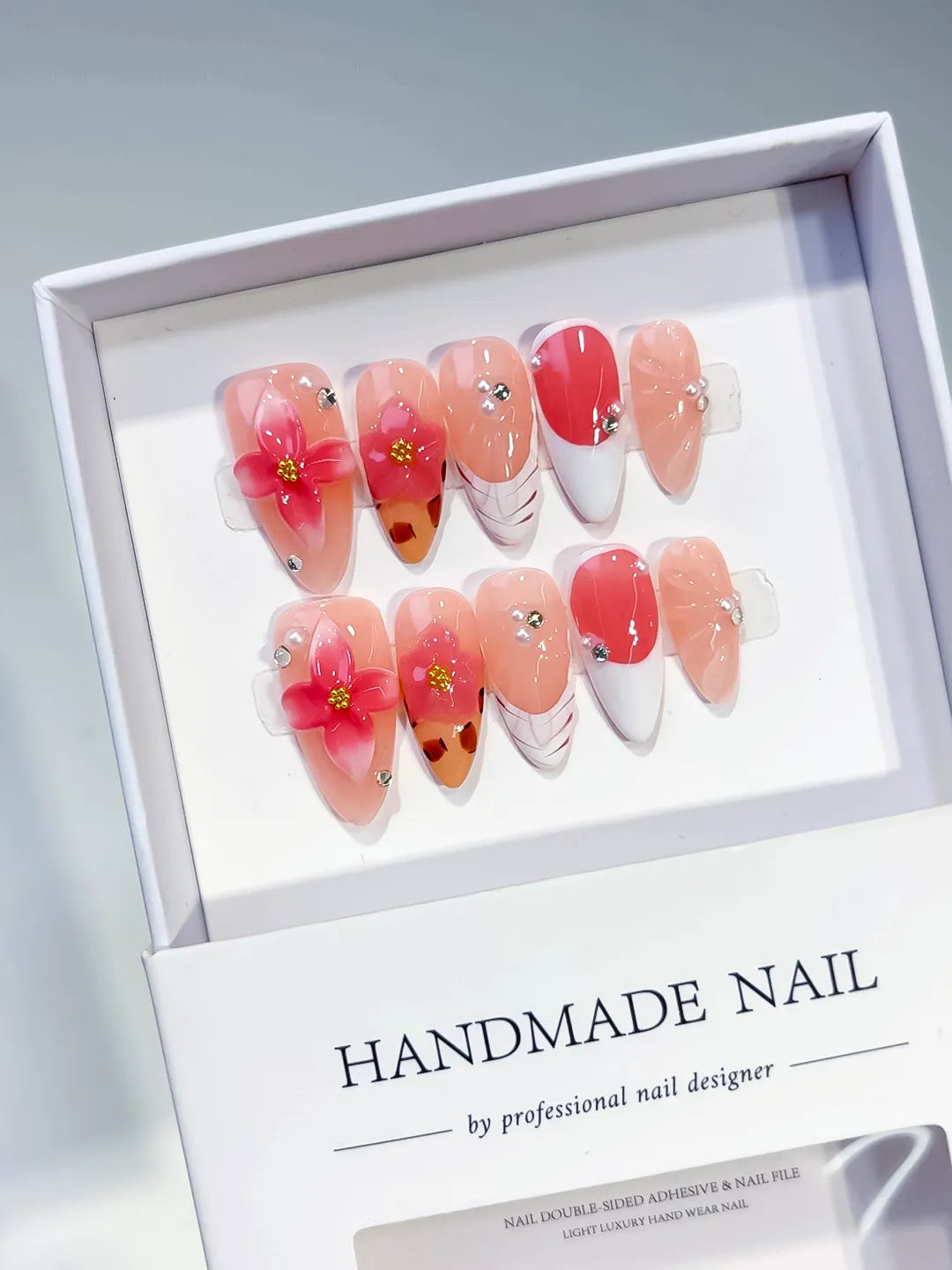 Nude Orange White Brown French tip Flower Animal Print Rhinestone press on nails angled view