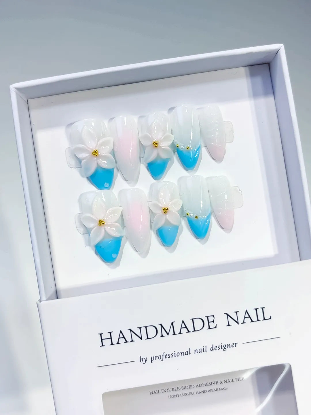 White Blue Pink French tip Flower press on nails angled view