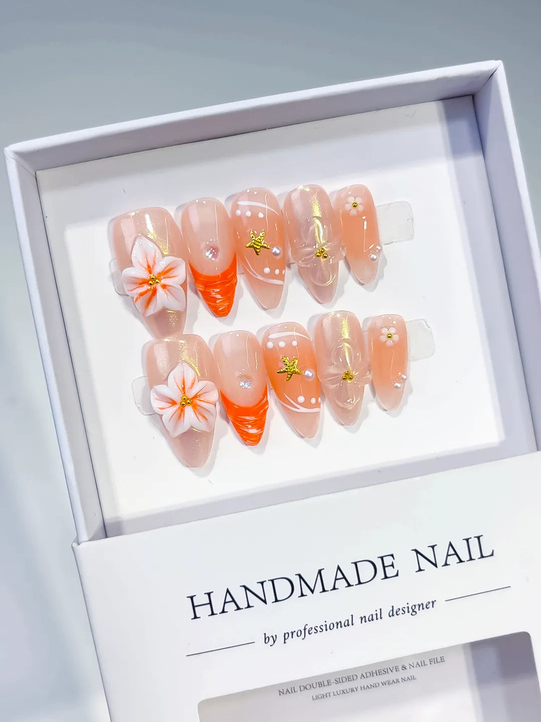Nude Orange Silver Holographic Flower Star Dot Pattern press on nails angled view