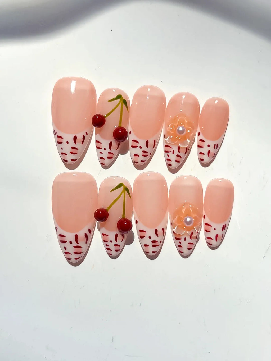 Nude White Red French tip Cherry Animal Print press on nails close up