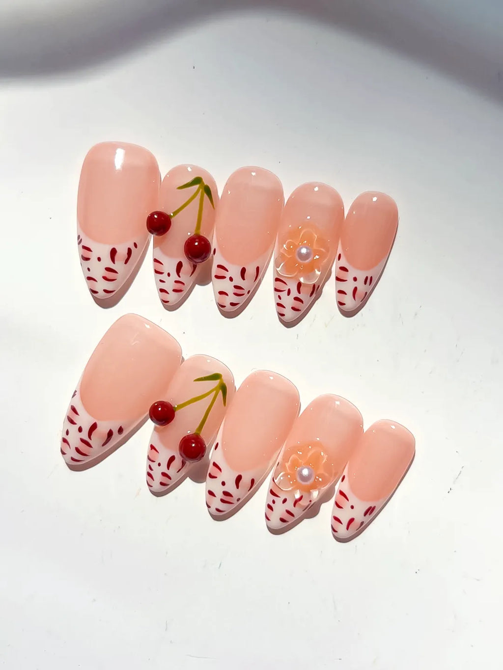 Nude White Red French tip Cherry Animal Print press on nails detail view