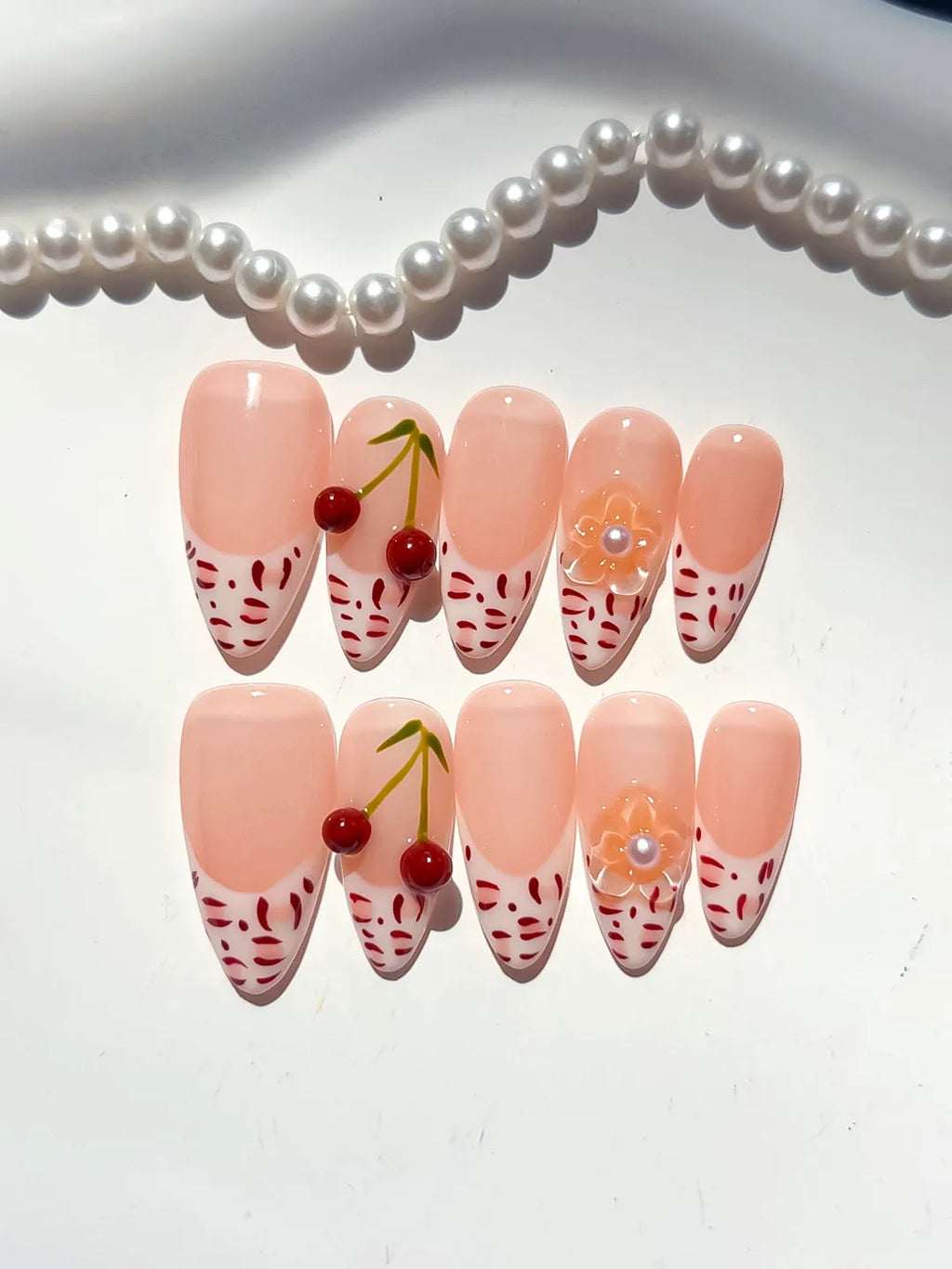 Nude White Red French tip Cherry Animal Print press on nails detail view