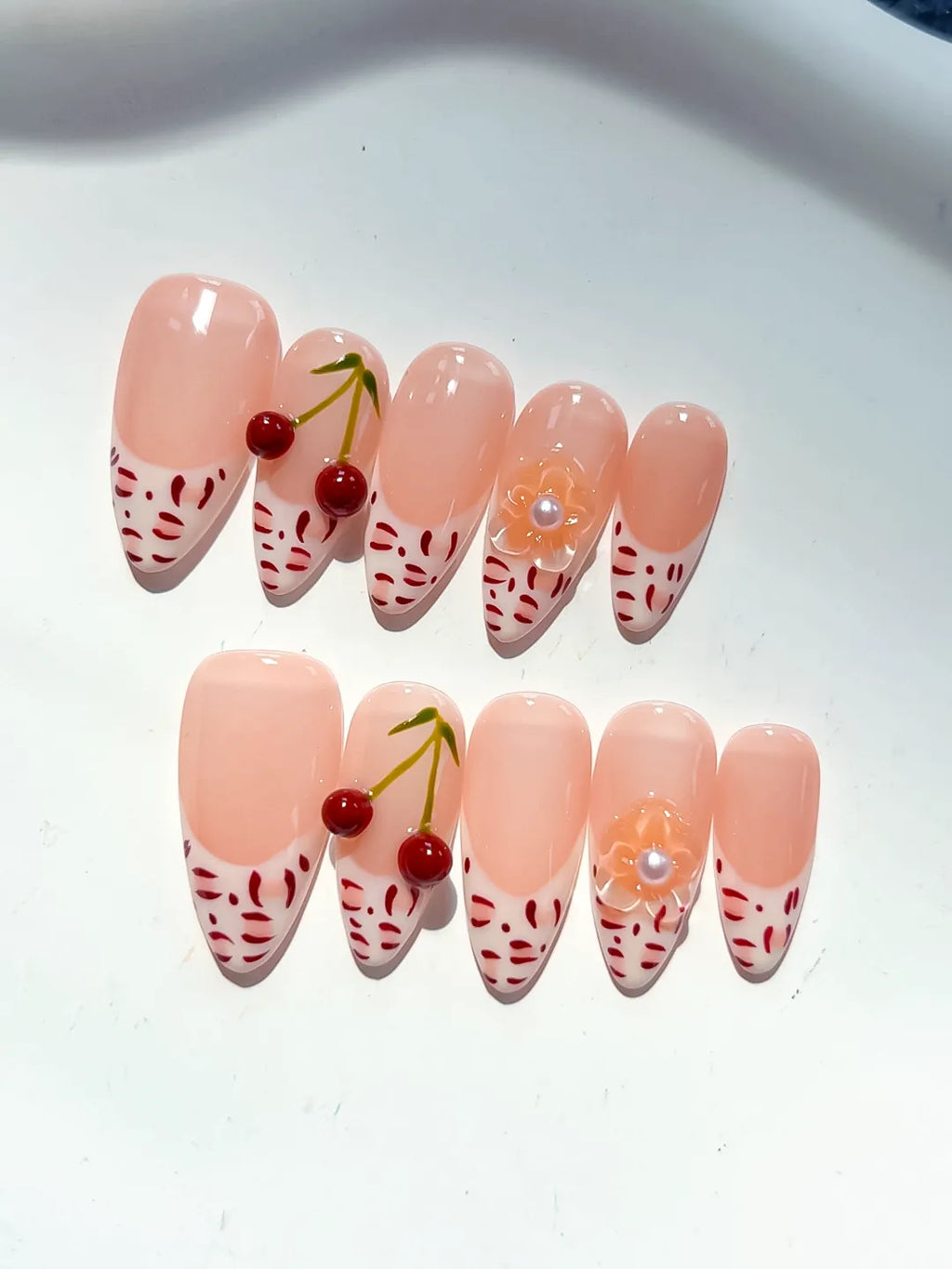 Nude White Red French tip Cherry Animal Print press on nails detail view
