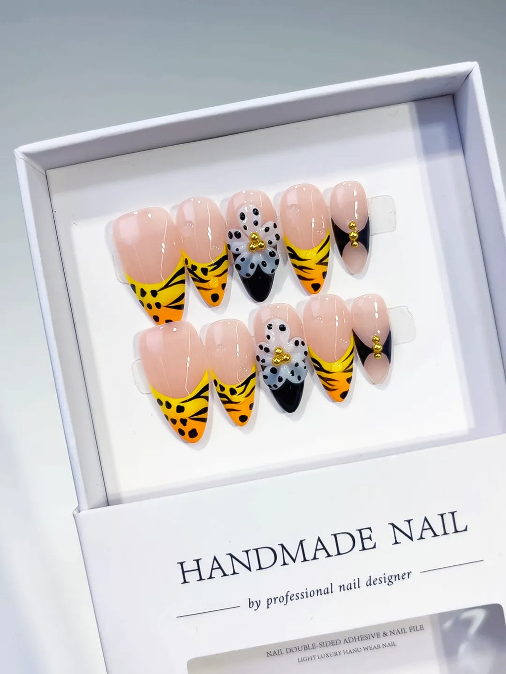 Nude Yellow Black French tip Flower Animal Print Metallic Charm press on nails angled view