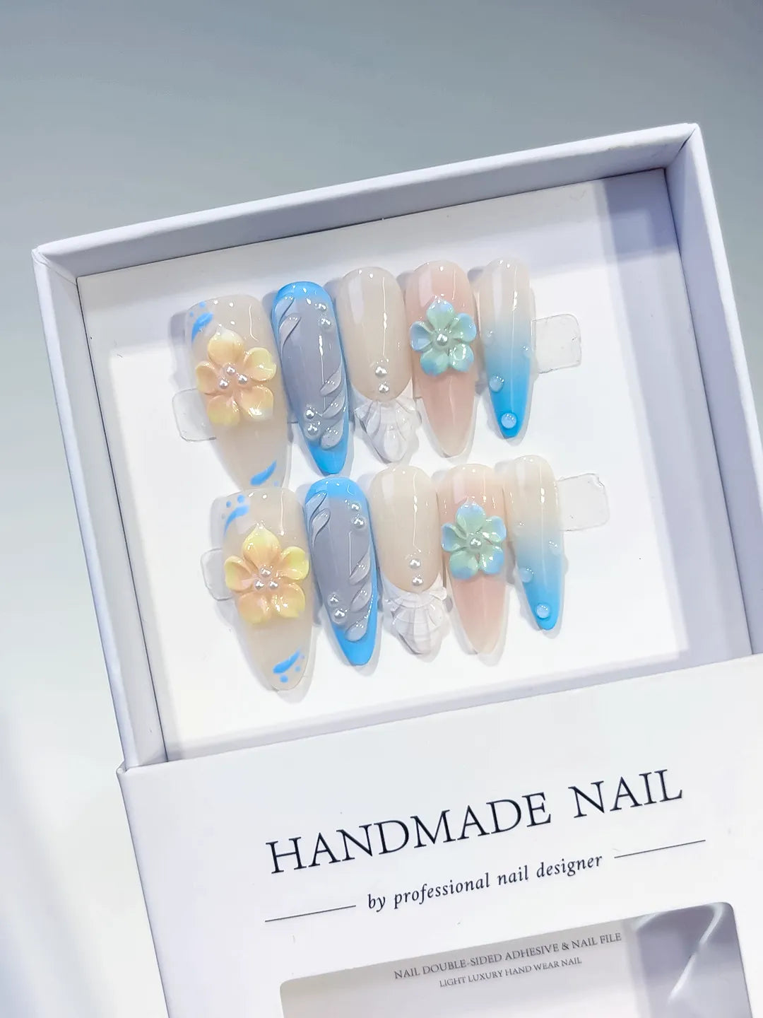 Nude Blue White French tip Flower Rhinestone press on nails angled view