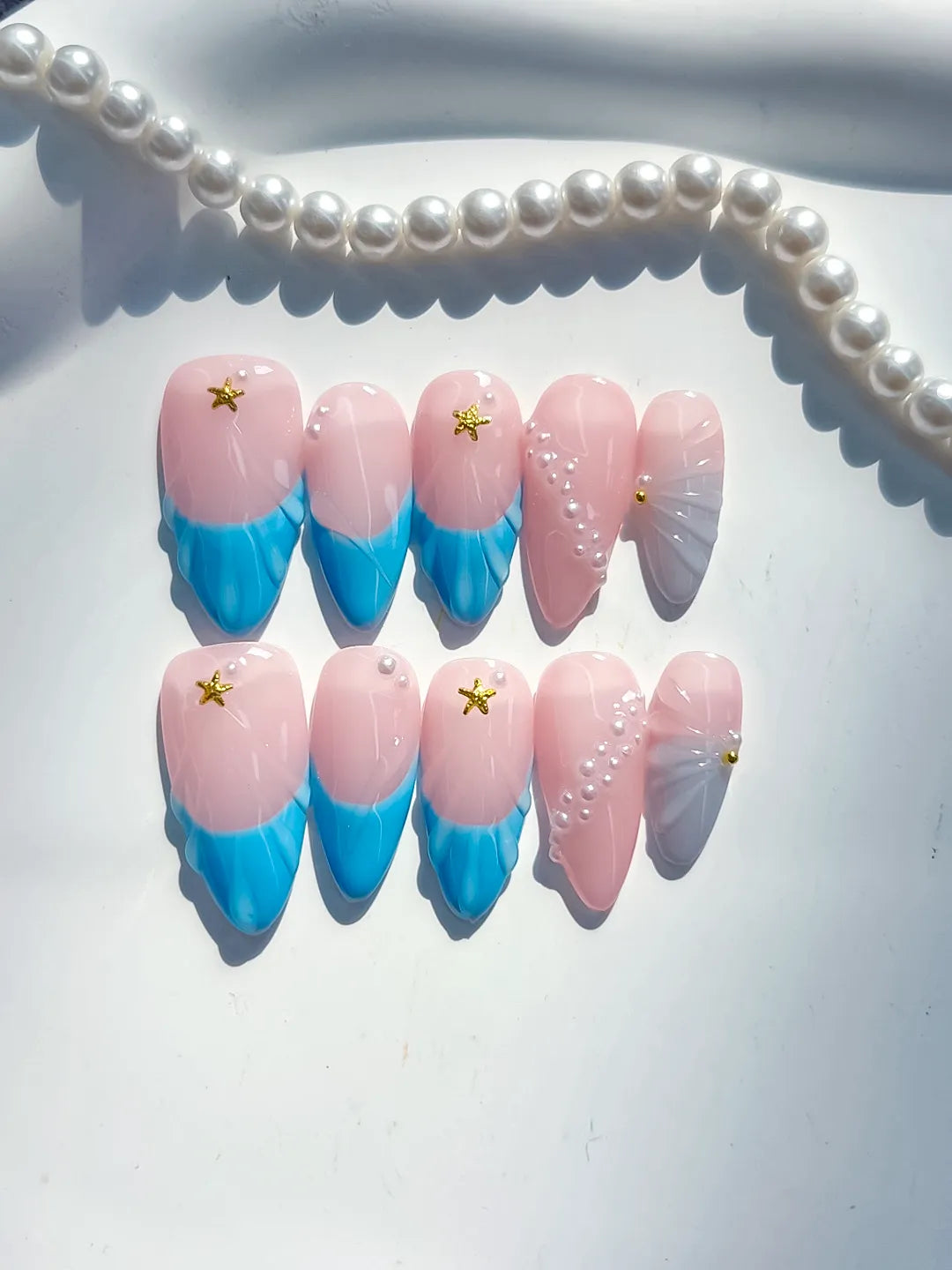 Pink Blue Silver Ombre Star Shell press on nails close up