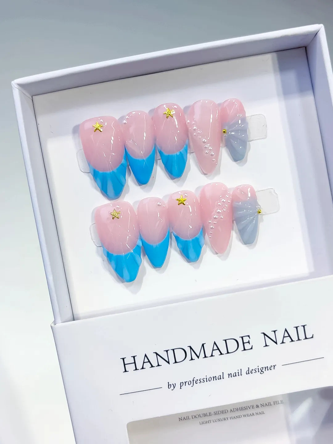 Pink Blue Silver Ombre Star Shell press on nails angled view