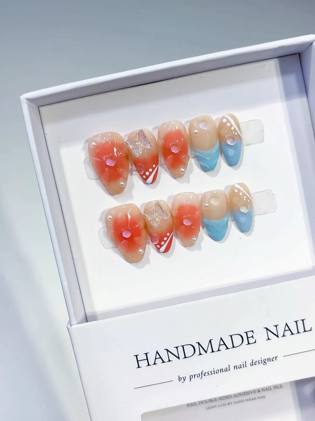Nude Orange Blue White Gold Abstract Flower Bow Dot Pattern press on nails angled view