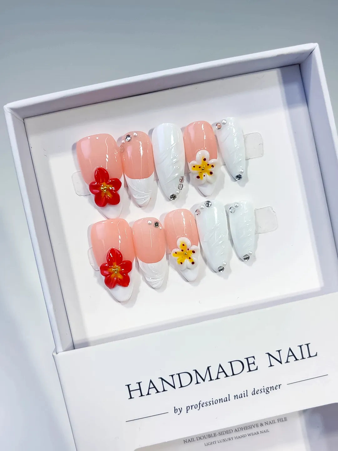 Pink White French tip Flower Rhinestone Shell press on nails angled view