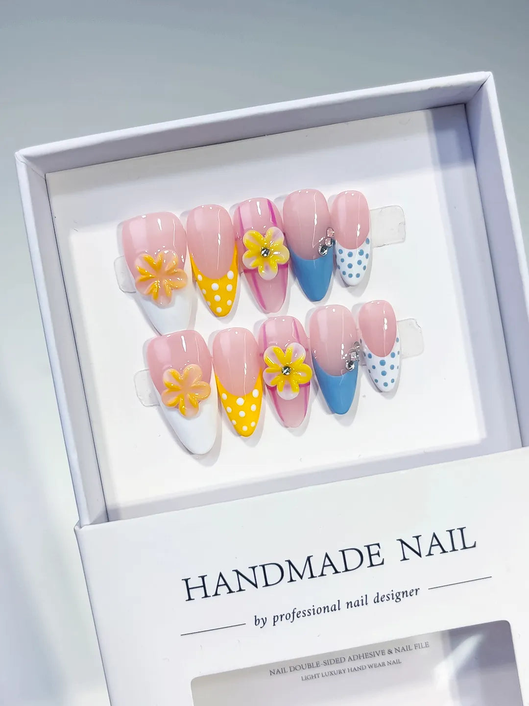 Pink Yellow Blue White French tip Flower Dot Pattern Rhinestone press on nails angled view