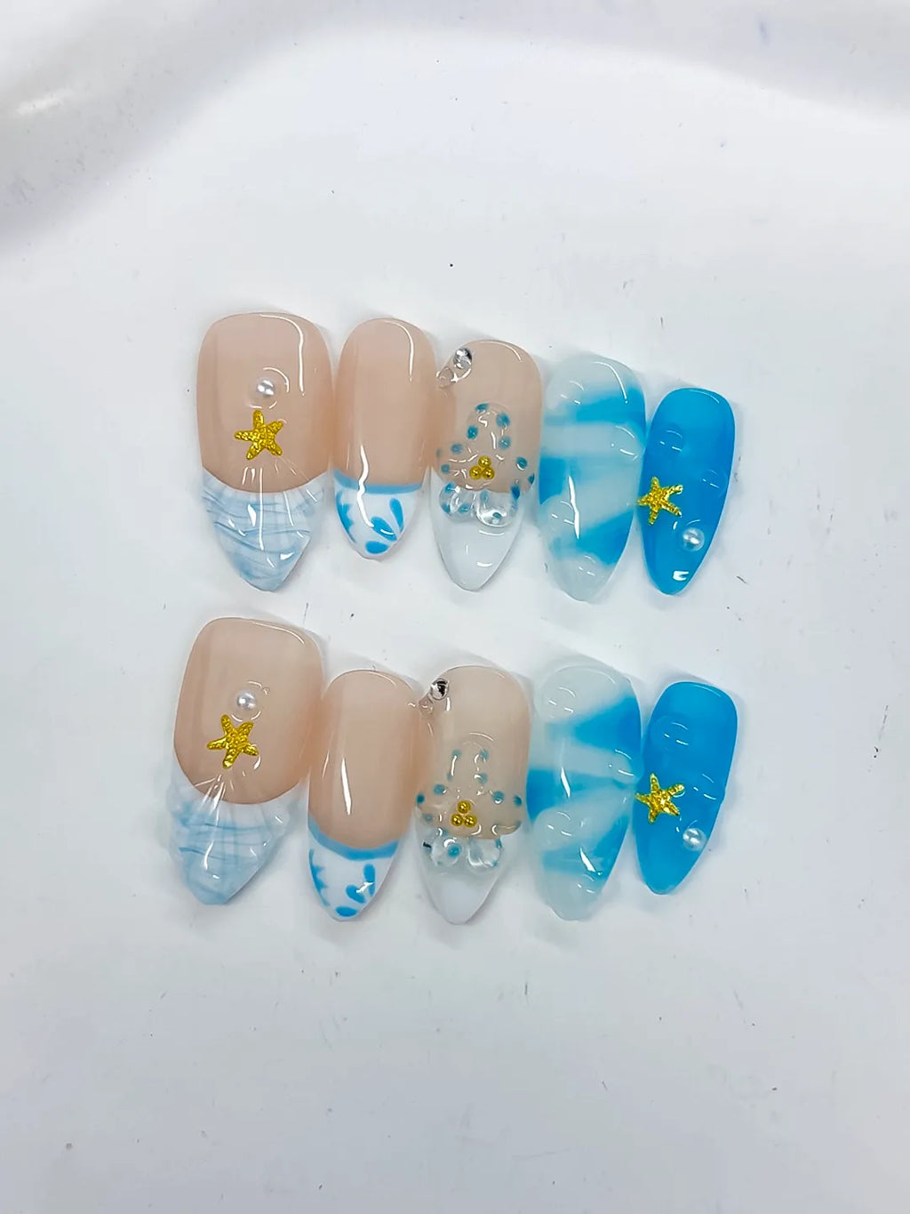 Nude Blue White French tip Star Rhinestone Shell press on nails detail view