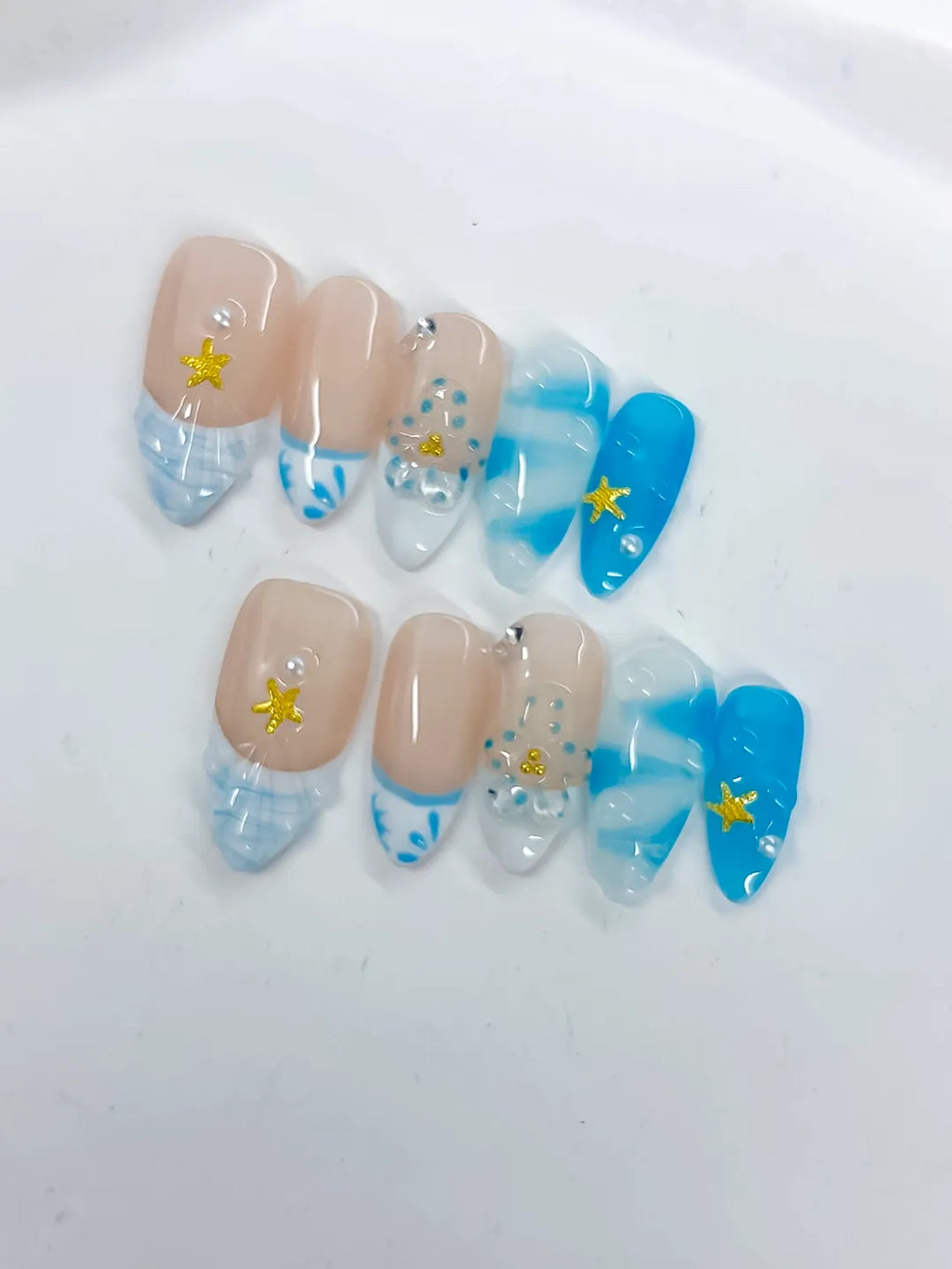 Nude Blue White French tip Star Rhinestone Shell press on nails close up