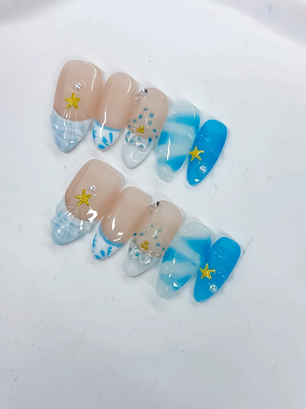Nude Blue White French tip Star Rhinestone Shell press on nails detail view