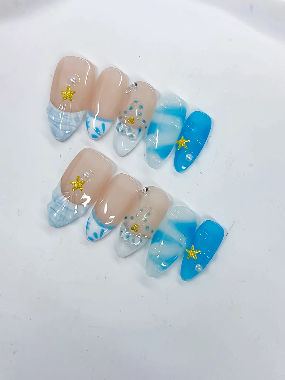 Nude Blue White French tip Star Rhinestone Shell press on nails detail view