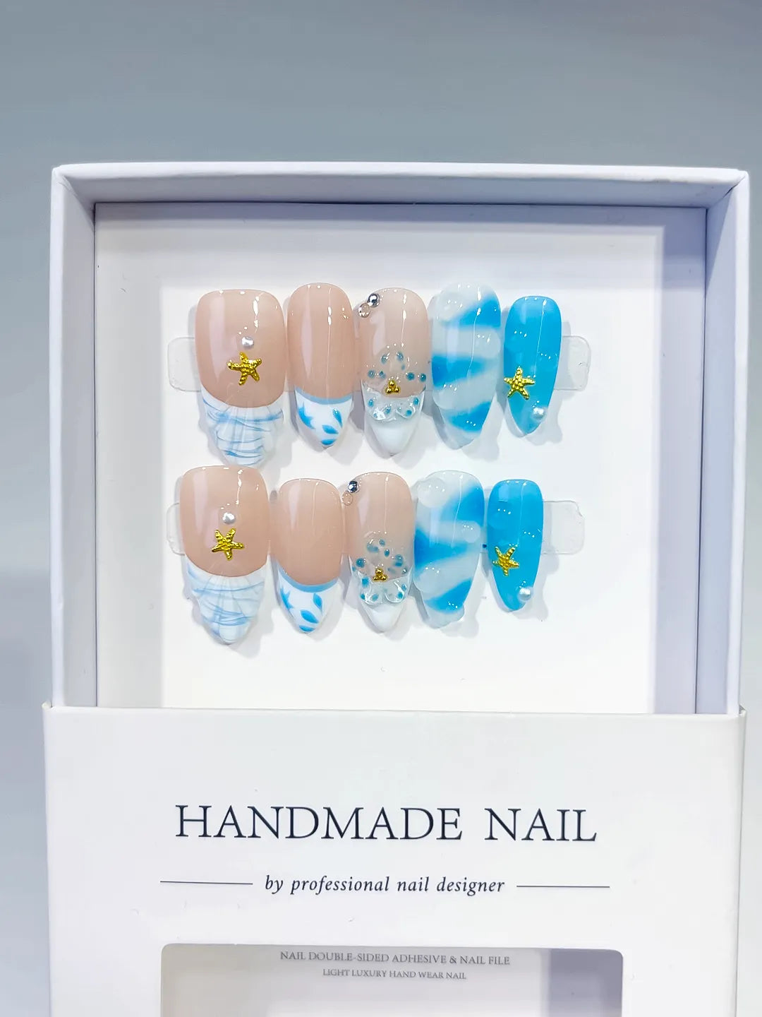 Nude Blue White French tip Star Rhinestone Shell press on nails full set view