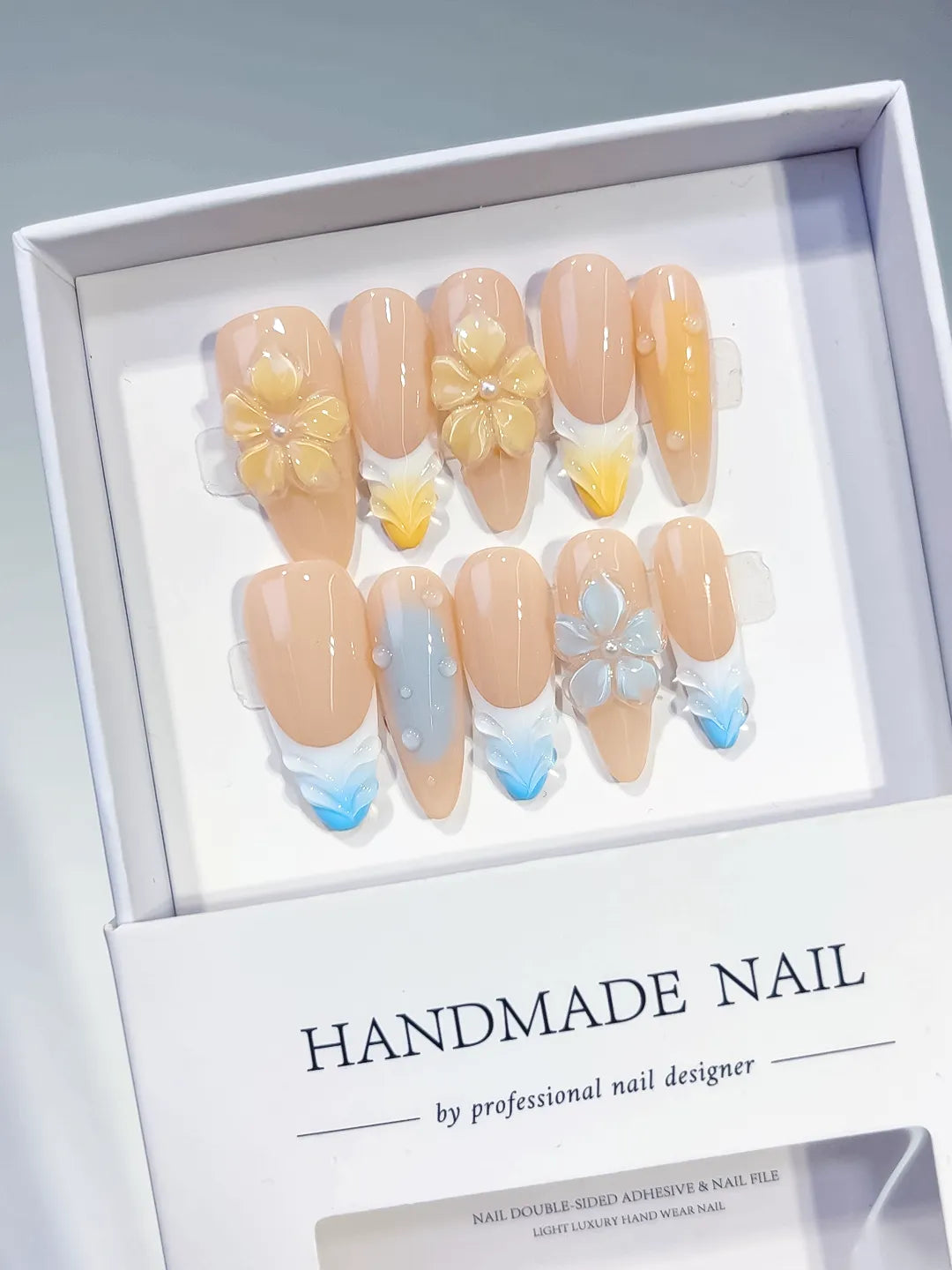 Nude Yellow Blue White French tip Flower Pearl press on nails angled view