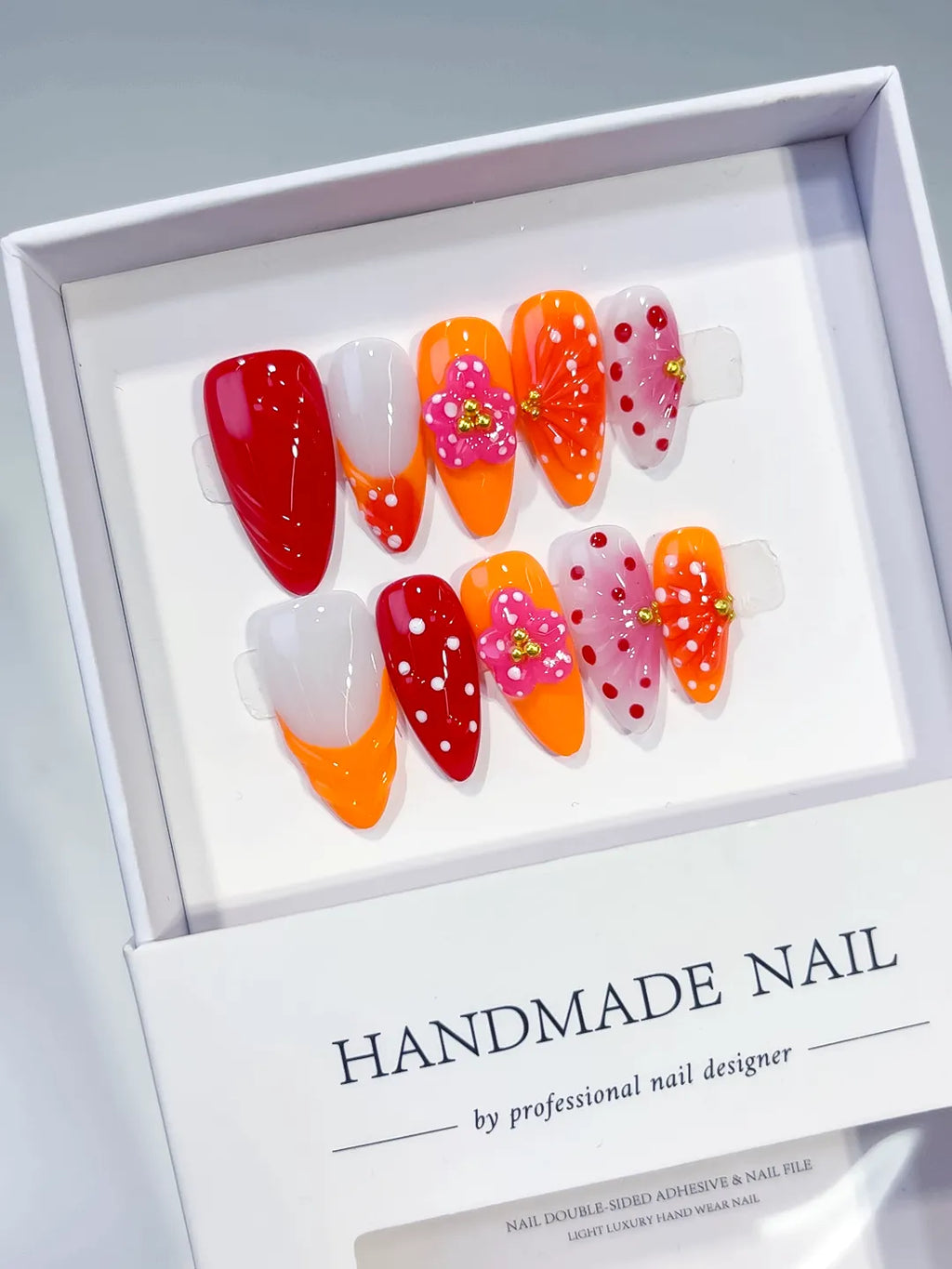 Red Orange White Pink Abstract Flower Dot Pattern Stud press on nails angled view