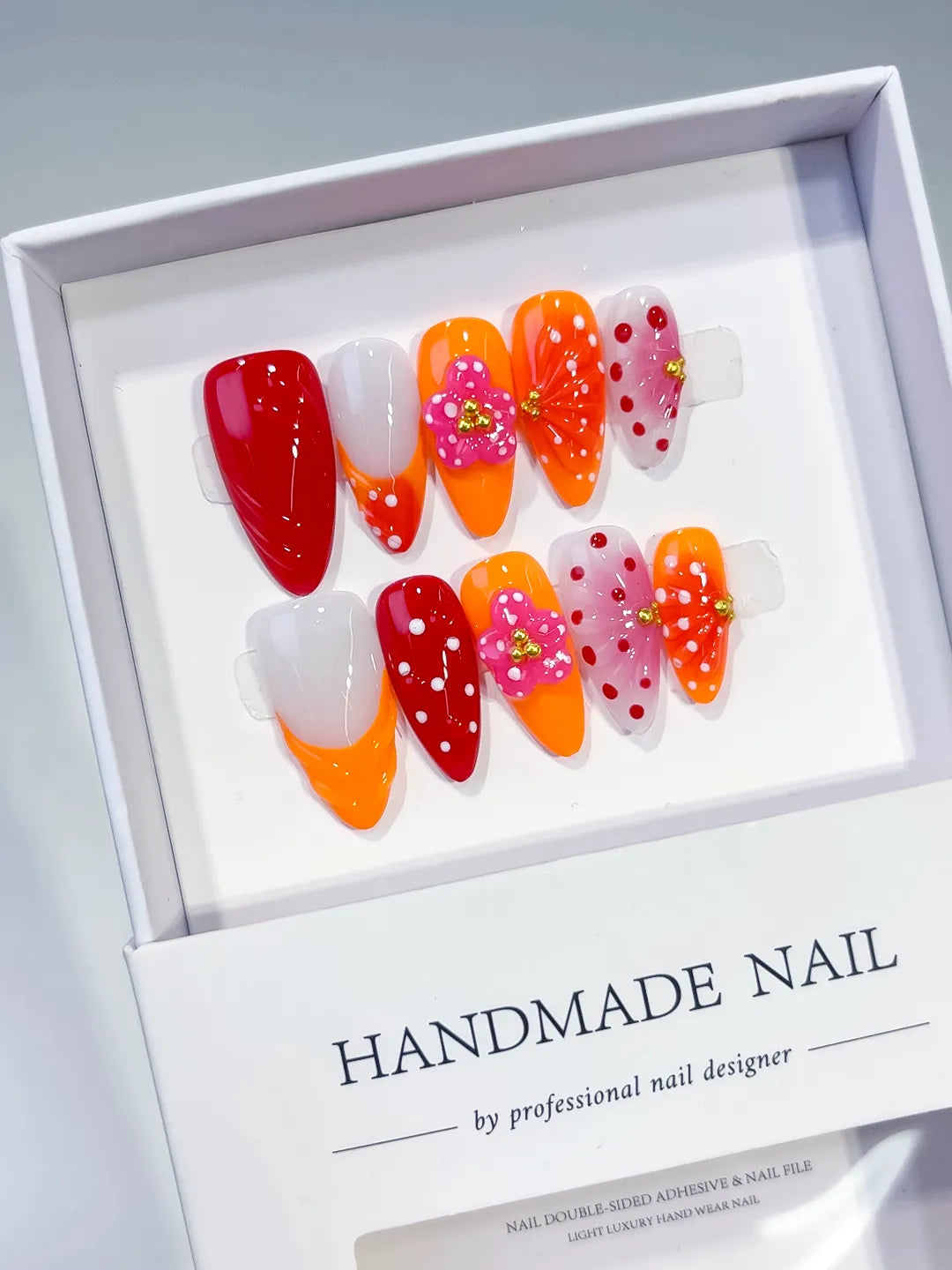 Red Orange White Pink Abstract Flower Dot Pattern Stud press on nails angled view